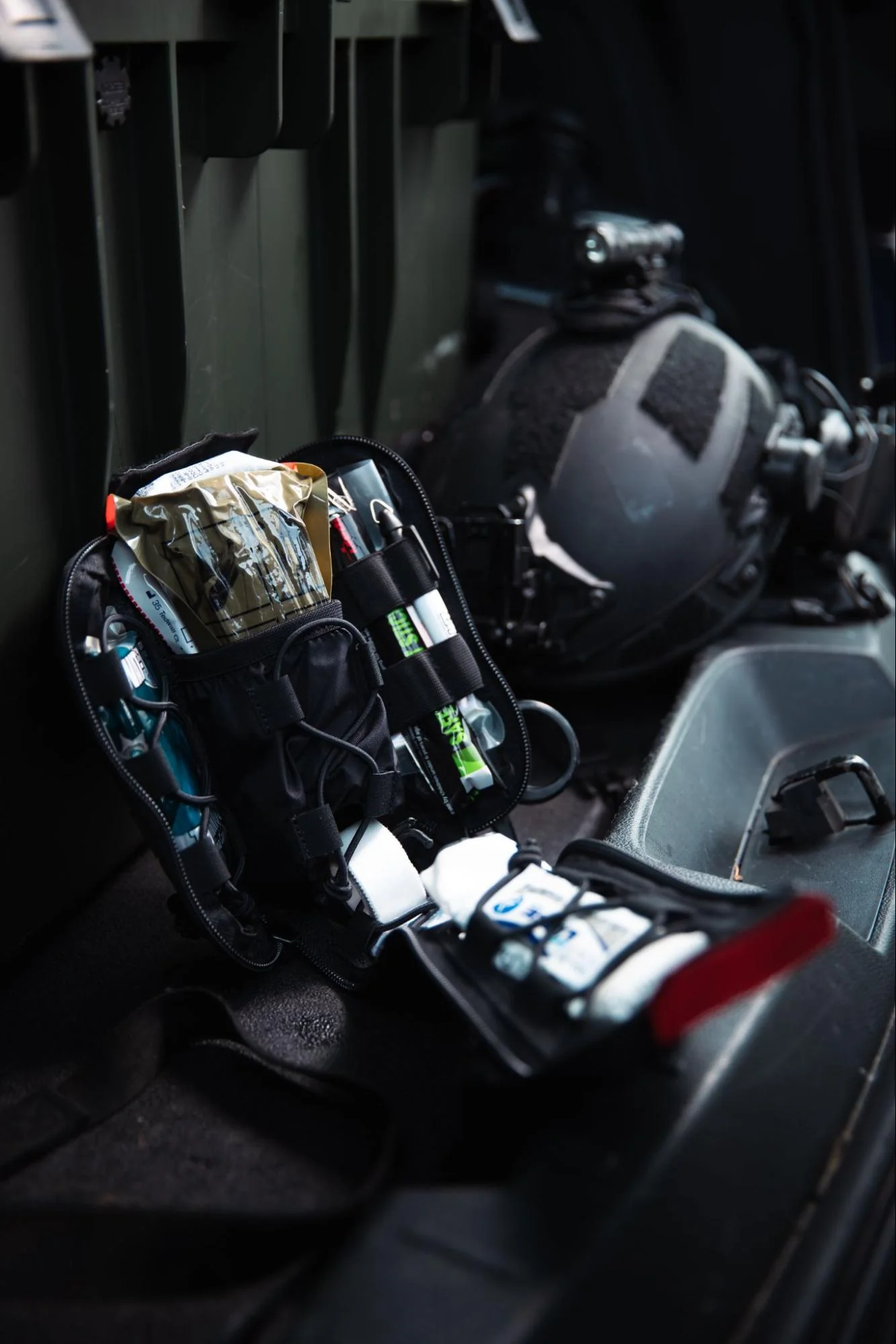 IFAK trauma kit staged in a tactical vehicle interior